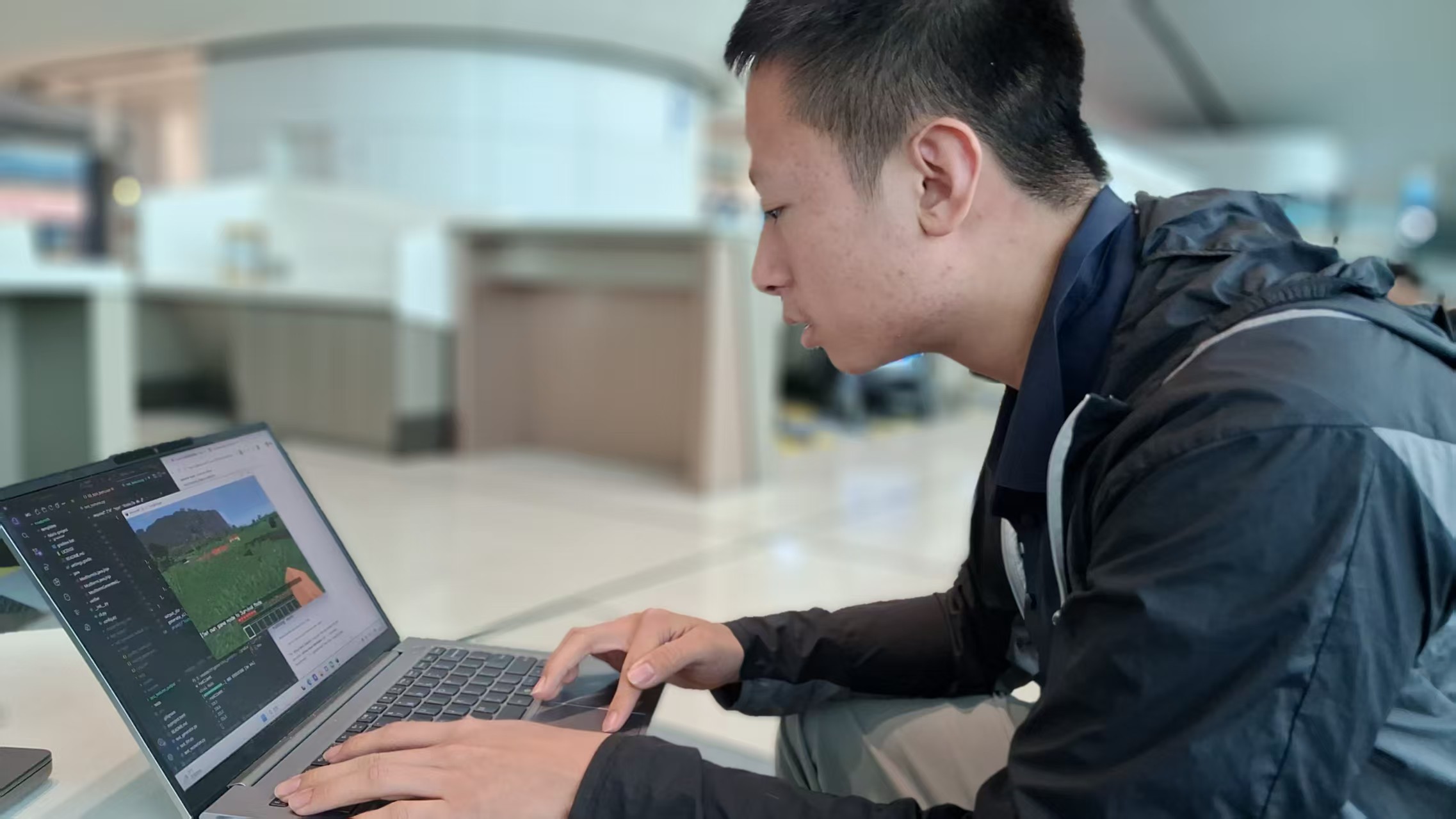 Evan coding Minecraft mods in a modern workspace